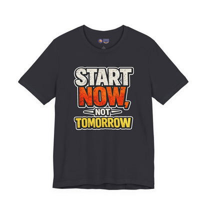 Gray t-shirt with motivational text 'Start Now, Not Tomorrow' on a white background