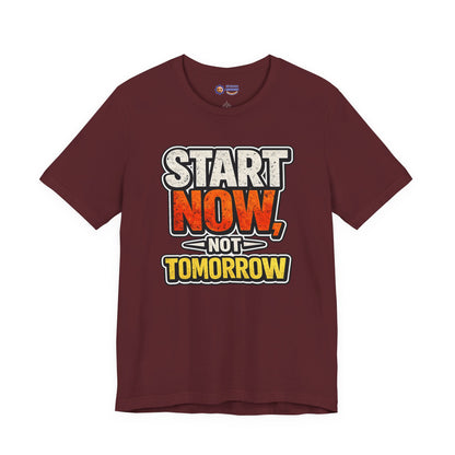 Maroon t-shirt with motivational text 'Start Now, Not Tomorrow' on a white background
