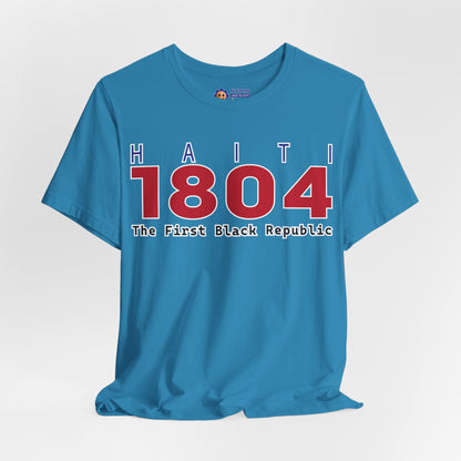 Blue t-shirt with 'Haiti 1804 The First Black Republic' text on a white background