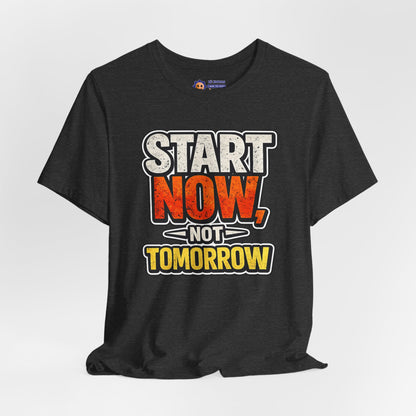 Black t-shirt with motivational quote 'Start Now, Not Tomorrow' on a white background