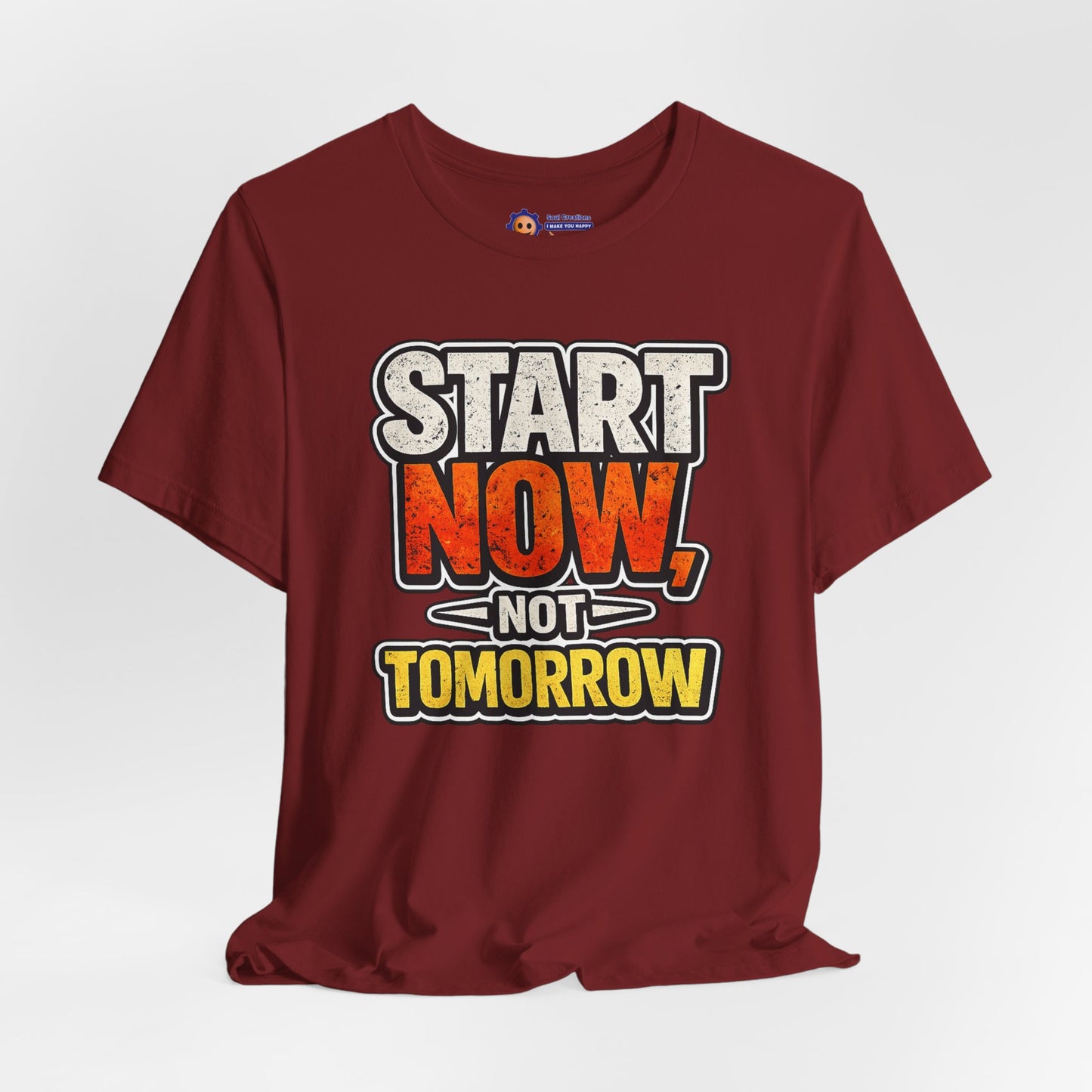 Maroon t-shirt with motivational text 'Start Now, Not Tomorrow' on a white background