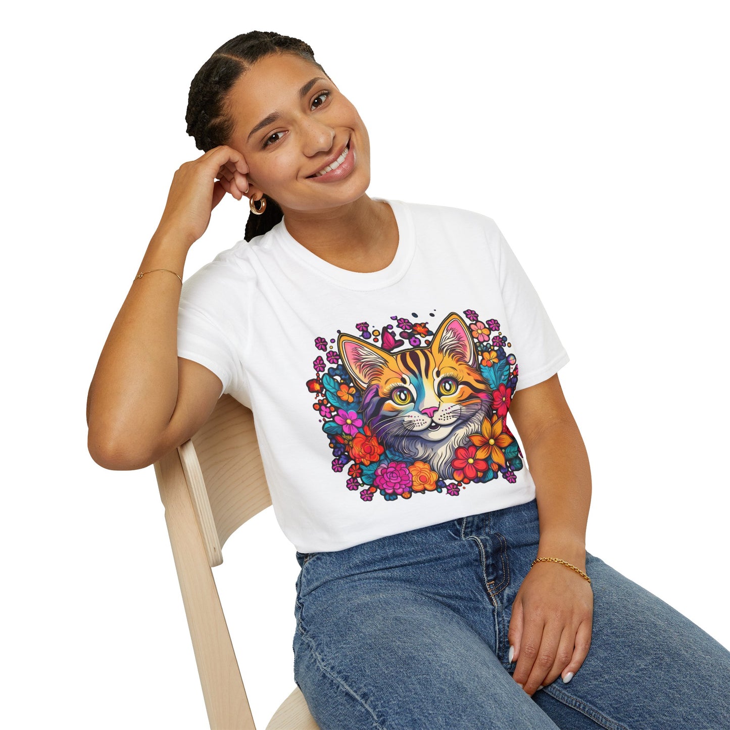 Person wearing a white t-shirt with a colorful cat design on a white background