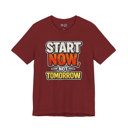 Maroon t-shirt with motivational text 'Start Now, Not Tomorrow' on a white background