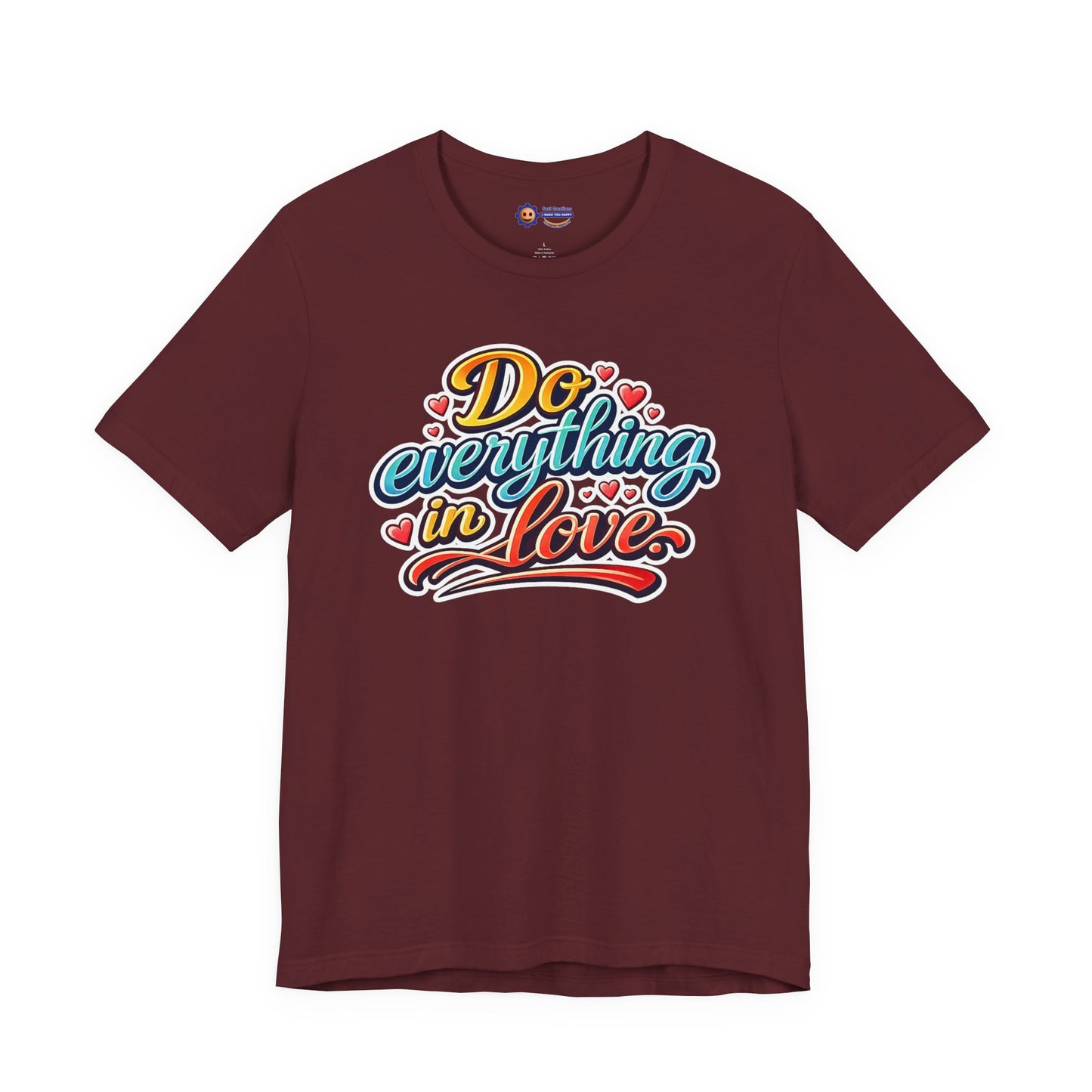 Maroon t-shirt with colorful text 'Do everything in love' on a white background