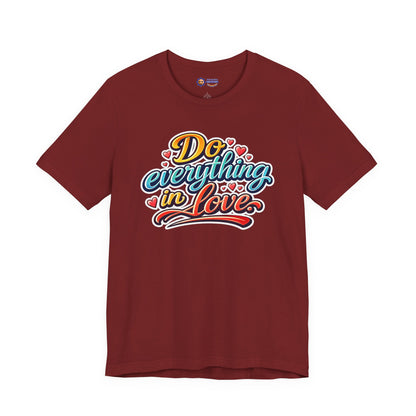 Maroon t-shirt with colorful 'Do everything in love' text design on a white background