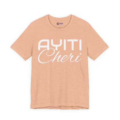 Heather Peach t-shirt with 'Ayiti Cheri' text on a white background