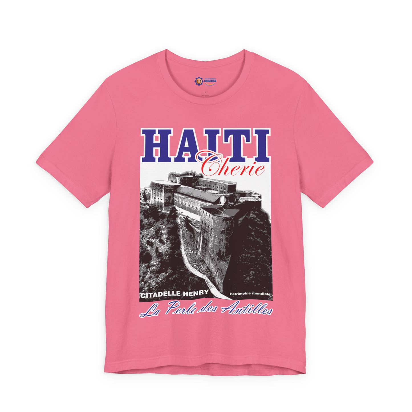 Pink t-shirt with Haiti-themed design featuring a castle and text on a white background