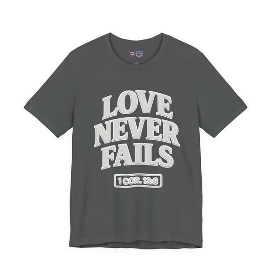 Asphalt t-shirt with 'LOVE NEVER FAILS' text on a white background